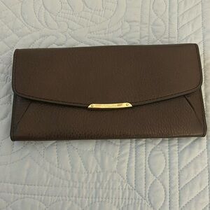 NWT Coach wallet. Pebbled leather with gold tone hardware.